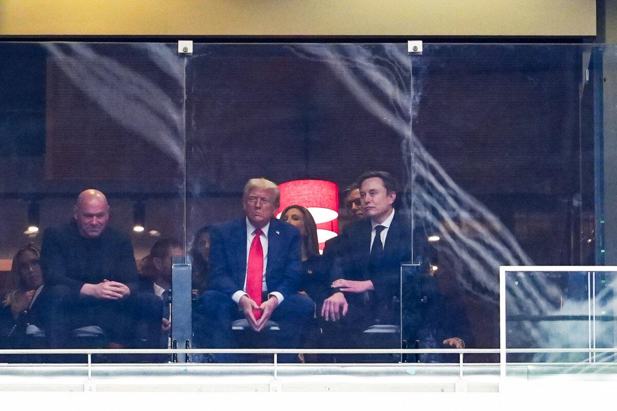 President Donald Trump and Tesla CEO Elon Musk attend the Building a Legacy: Remembering Charlie Kirk Memorial event at the State Farm Stadium in Glendale, Ariz., on Sept. 21, 2025. (Madalina Kilroy/The Epoch Times)
