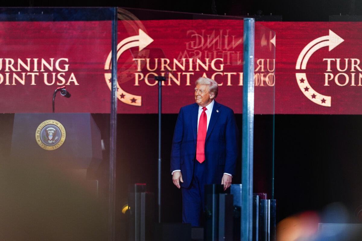 President Donald Trump speaks at the Building a Legacy: Remembering Charlie Kirk Memorial event at the State Farm Stadium in Glendale, Ariz., on Sept. 21, 2025. (Madalina Kilroy/The Epoch Times)