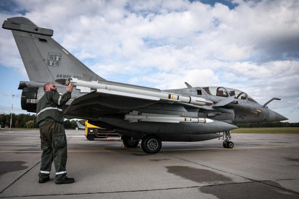 A French Air Force mechanic checks a MICA missile system on a Rafale fighter jet at a Polish airbase on Sept. 17, 2025, as part of NATO's "Eastern Sentry" mission. (Thibaud Moritz/AFP via Getty Images)