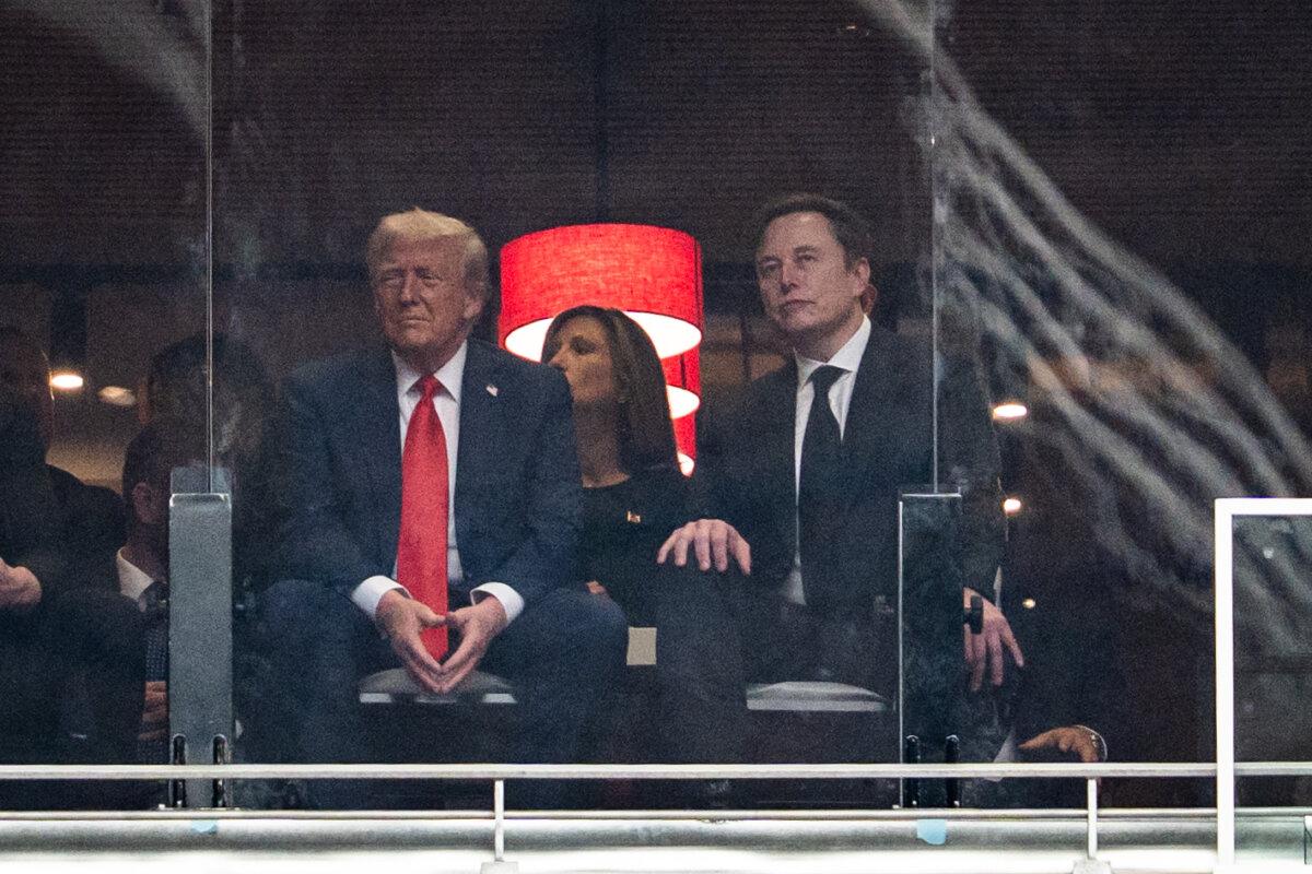President Donald Trump and Tesla CEO Elon Musk attend the Building a Legacy: Remembering Charlie Kirk Memorial event at the State Farm Stadium in Glendale, Ariz., on Sept. 21, 2025. (Madalina Kilroy/The Epoch Times)