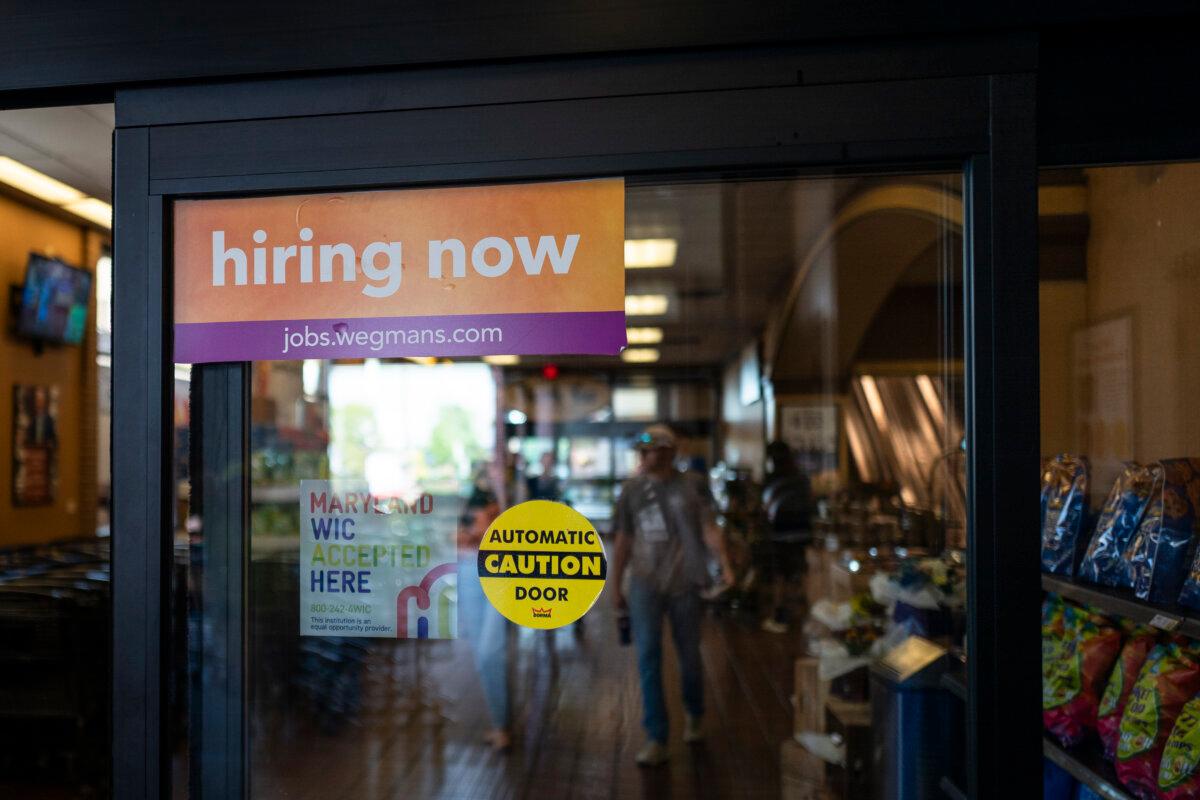 A hiring ad is displayed at a store in Columbia, Md., on Sept. 18, 2025. (Madalina Kilroy/The Epoch Times)