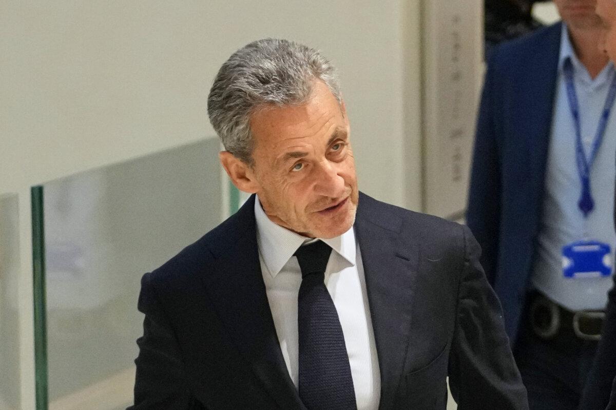 Former French President Nicolas Sarkozy arrives at the the Tribunal de Paris courthouse, in Paris, France, on Sept. 25, 2025. (AP Photo/Christophe Ena)
