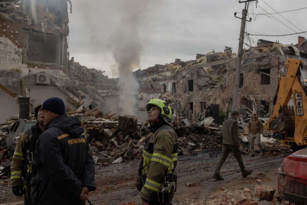 Pressure Mounts on EU to Push Beijing to Halt Russian Oil Imports 3 Ukrainian rescuers work at the site of heavily damaged residential buildings following a Russian air attack in Kyiv, Ukraine, on Sept. 28, 2025. (Roman Pilipey /AFP via Getty Images)
