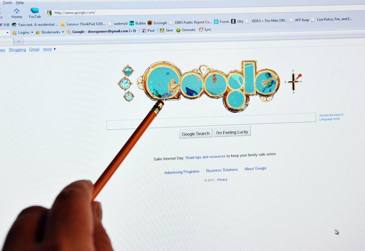 A man checks out the homepage of Google internet search engine in Washington, DC, on Feb. 8, 2011. (Jewel Samad/AFP via Getty Images)