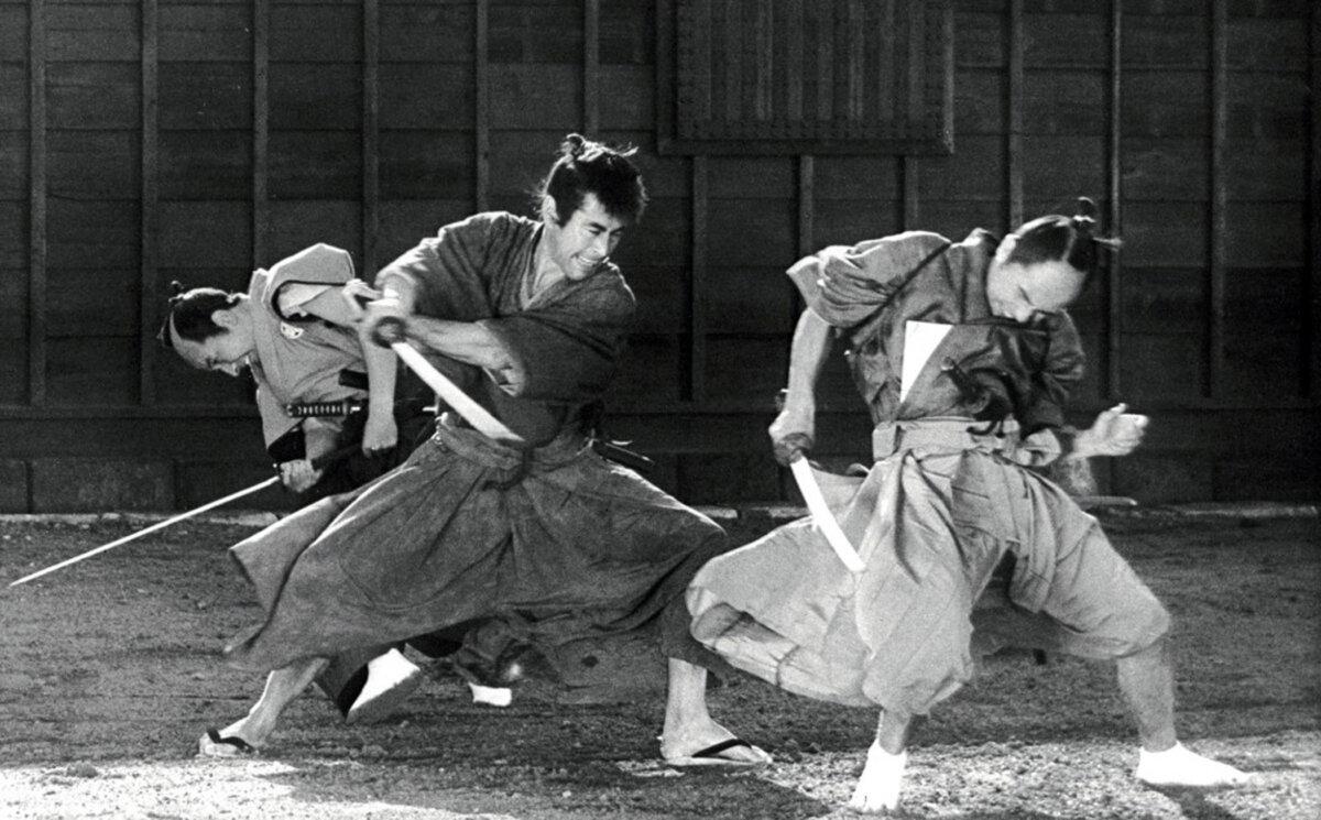 Tsuruchiyo Niiro (Toshiro Mifune, C) is pretty handy with a sword, in “Samurai Assassin.” (Toho)