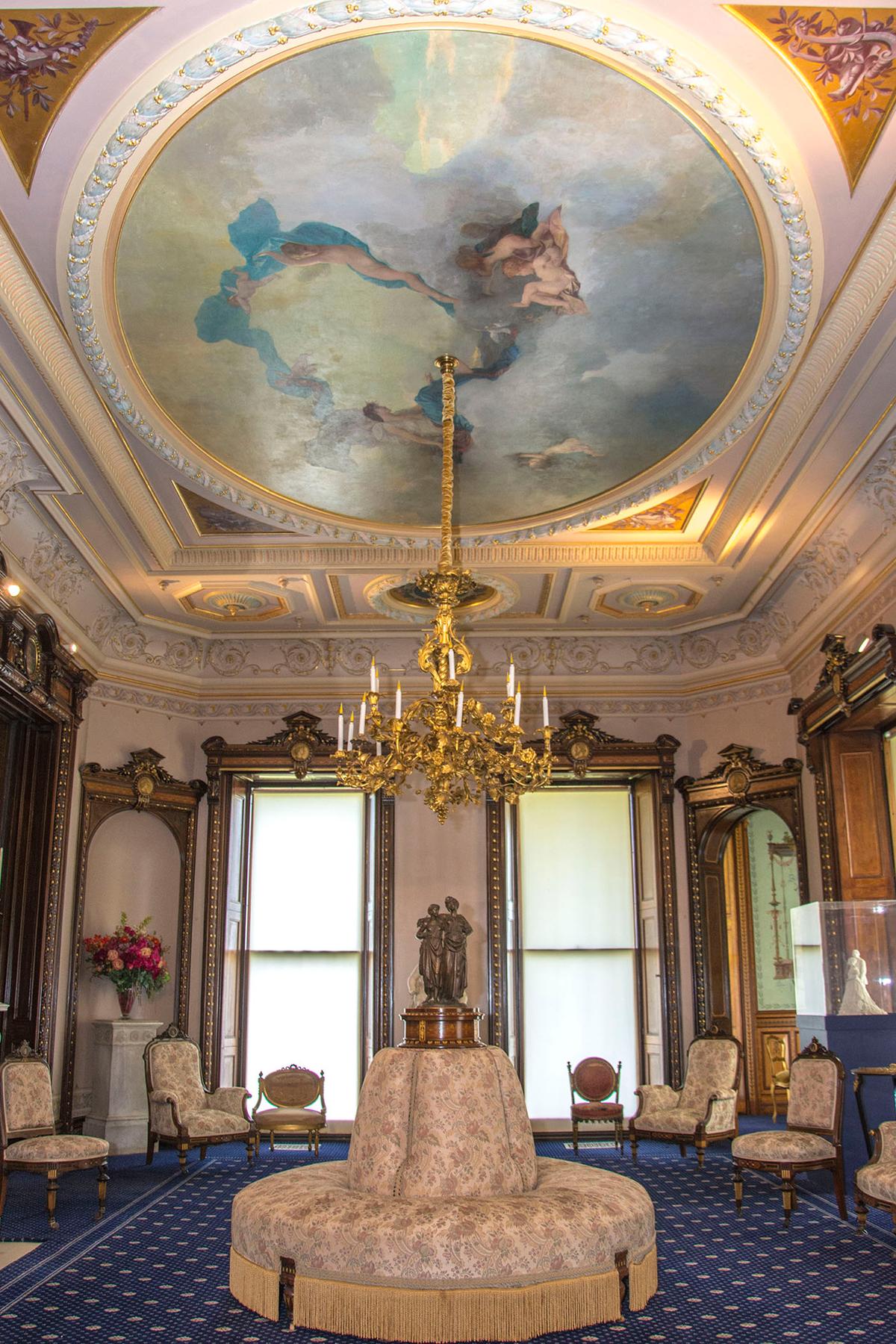 The Grand Salon's sumptuous interior was designed by the Herter Brothers and features gilded moldings, Louis XV furniture, and rosewood woodwork inlaid with boxwood, ebony, and cedar of Lebanon. The highlight of the room is the exquisite ceiling fresco of “Venus at Play with Her Cupids” by French artist Pierre-Victor Galland (1822–1892). (<a href="https://www.sarahgroteart.com/" target="_blank" rel="nofollow noopener">Sarah Grote Photography</a>/Lockwood-Mathews Mansion Museum)