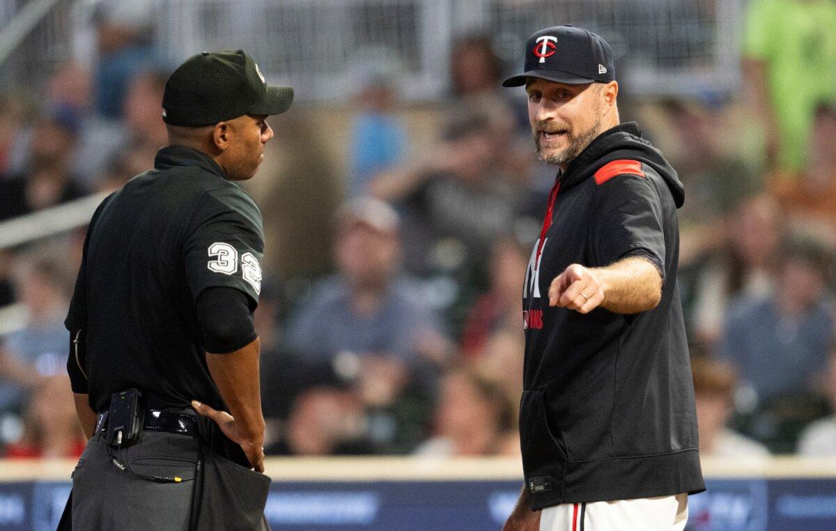 Manager Rocco Baldelli of the Minnesota Twins argues with home plate umpire Edwin Moscoso during a game against the Arizona Diamondbacks at Target Field in Minneapolis on Sept. 13, 2025. (Stephen Maturen/Getty Images)