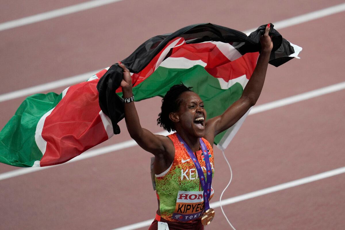 Kenya's Faith Kipyegon celebrates after competing the women's 1,500 meters final at the World Athletics Championships in Tokyo, on Sept. 16, 2025. (Abbie Parr/AP Photo)