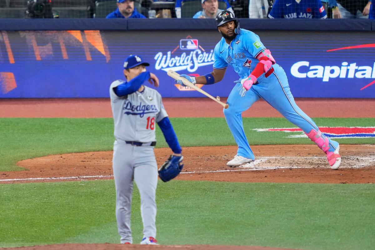 Vladimir Guerrero Jr. of the Toronto Blue Jays hits a double against Yoshinobu Yamamoto of the Los Angeles Dodgers during the sixth inning in Game 6 of the 2025 World Series at Rogers Centre in Toronto on Oct. 31, 2025. (Mark Blinch/Getty Images)