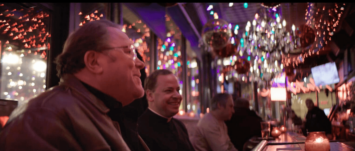 Kevin Matthews hanging out with priests, in “Broken Mary: The Kevin Matthews Story." (Fathom Entertainment)