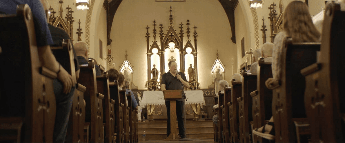 Kevin Matthews shares his story to the congregation, in “Broken Mary: The Kevin Matthews Story." (Fathom Entertainment)