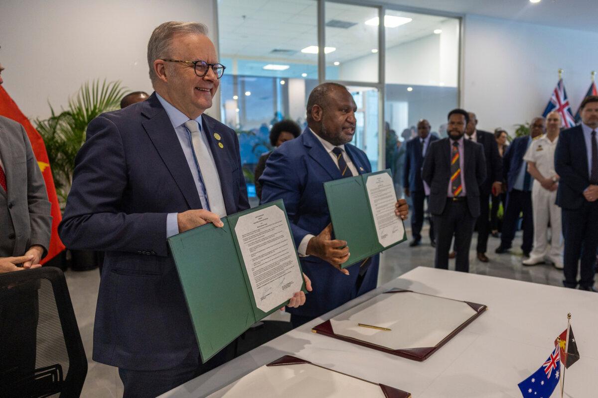 Australian Prime Minister Anthony Albanese and Papua New Guinea Prime Minister James Marape stand together after signing the Joint Communique on a Mutual Defence Treaty at Melanesian Haus, Waigani, on Sept. 17, 2025. (Jack Pearce/Department of Defence)