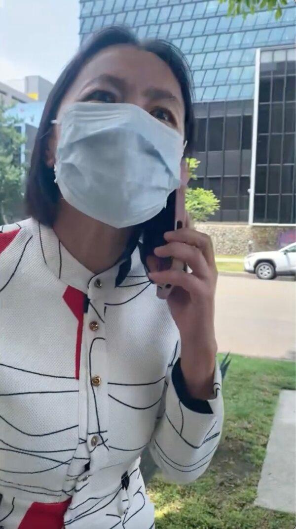 An unidentified woman seen yelling at Falun Gong practitioners outside the Chinese Consulate in Los Angeles on June 9, 2025. (Video screenshot/Courtesy of Falun Dafa Information Center)
