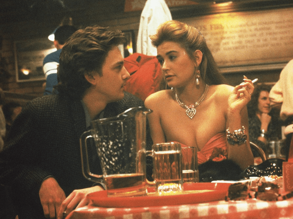 Kevin Dolenz (Andrew McCarthy) and Jules (Demi Moore) at a bar, in "St. Elmo's Fire." (Columbia Pictures)