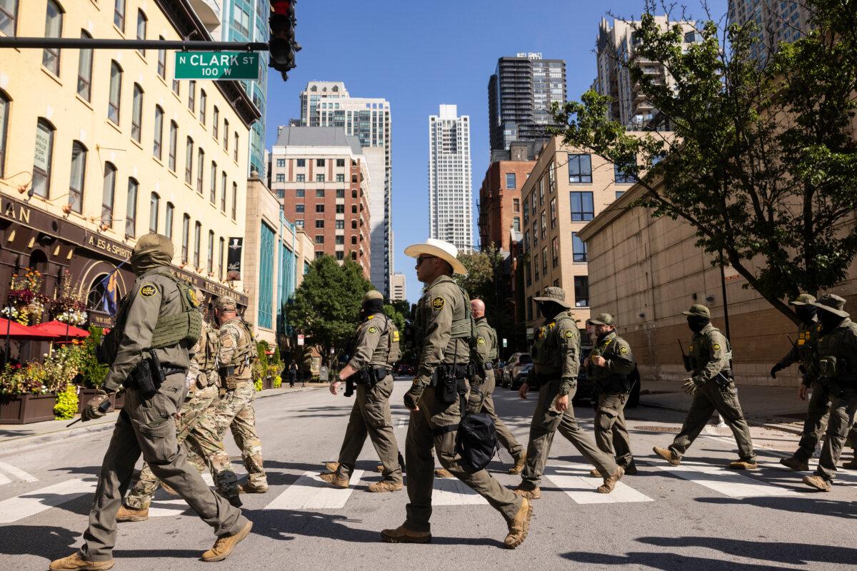 Mexican Cartels Placing Bounties on Federal Agents, DHS Says 2 Federal agents from U.S. Immigration and Customs Enforcement and U.S. Customs and Border Protection walk north on North Clark Street in the River North neighborhood in Chicago on Sept. 28, 2025. (Ashlee Rezin/Chicago Sun-Times via AP)
