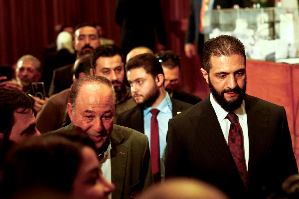 Syrian President Ahmed al-Sharaa visits an election hall as electoral colleges select incoming members of Syria's first post-Assad People's Assembly, in Syria on Oct. 5, 2025. (Yamam al Shaar/Reuters)
