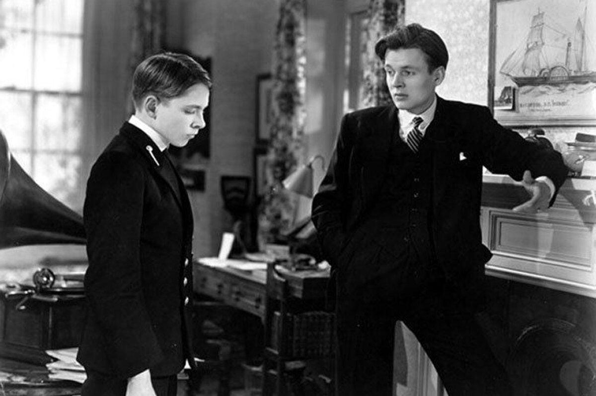 Ronnie Winslow (Neil North, L) is comforted by his older brother, Dickie (Jack Watling), in “The Winslow Boy.” (British Lion Films)