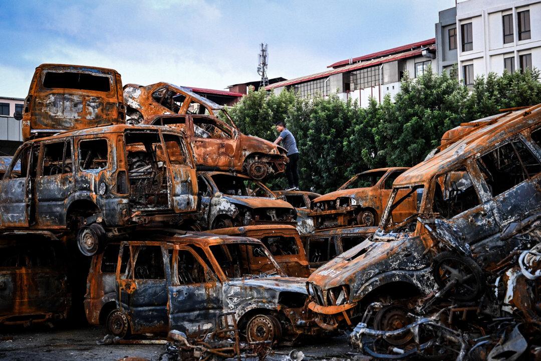 Day in Photos: The Burned Parliament in Nepal, Keir Starmer in India, and Livestock Summit