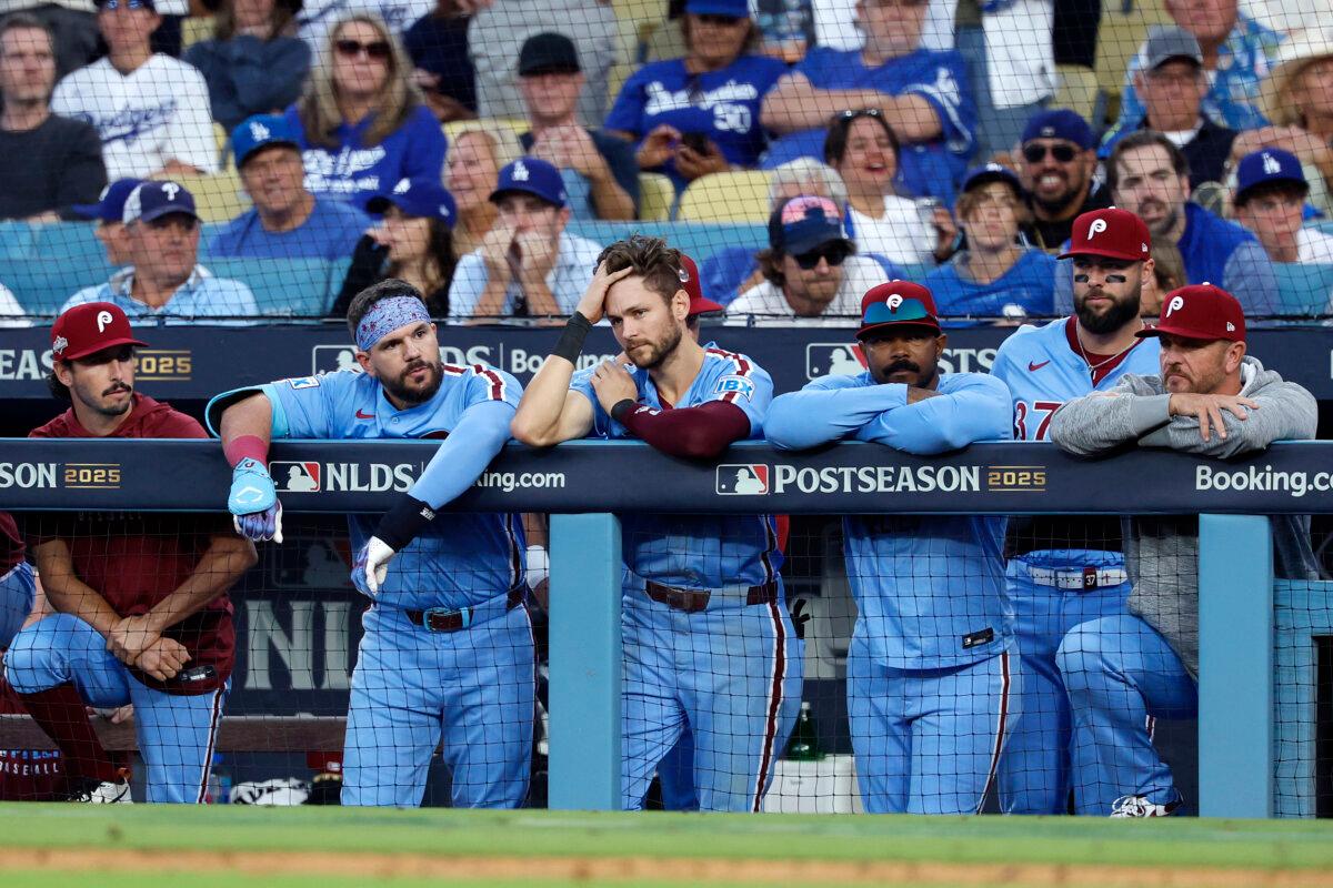 Philadelphia Phillies players look on from the dugout during the 11th inning against the Los Angeles Dodgers in game four of the National League Division Series at Dodger Stadium in Los Angeles on Oct. 9, 2025. (Harry How/Getty Images)