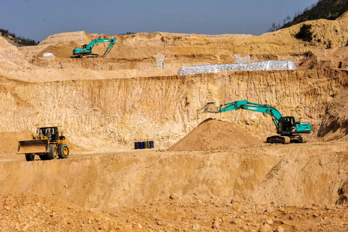US May Decouple From China if Rare Earth Dispute Persists: Bessent 2 Workers use machinery to dig at a rare-earth mine in Ganxian County, Jiangxi Province, China, on Dec. 30, 2010. (Chinatopix via AP)