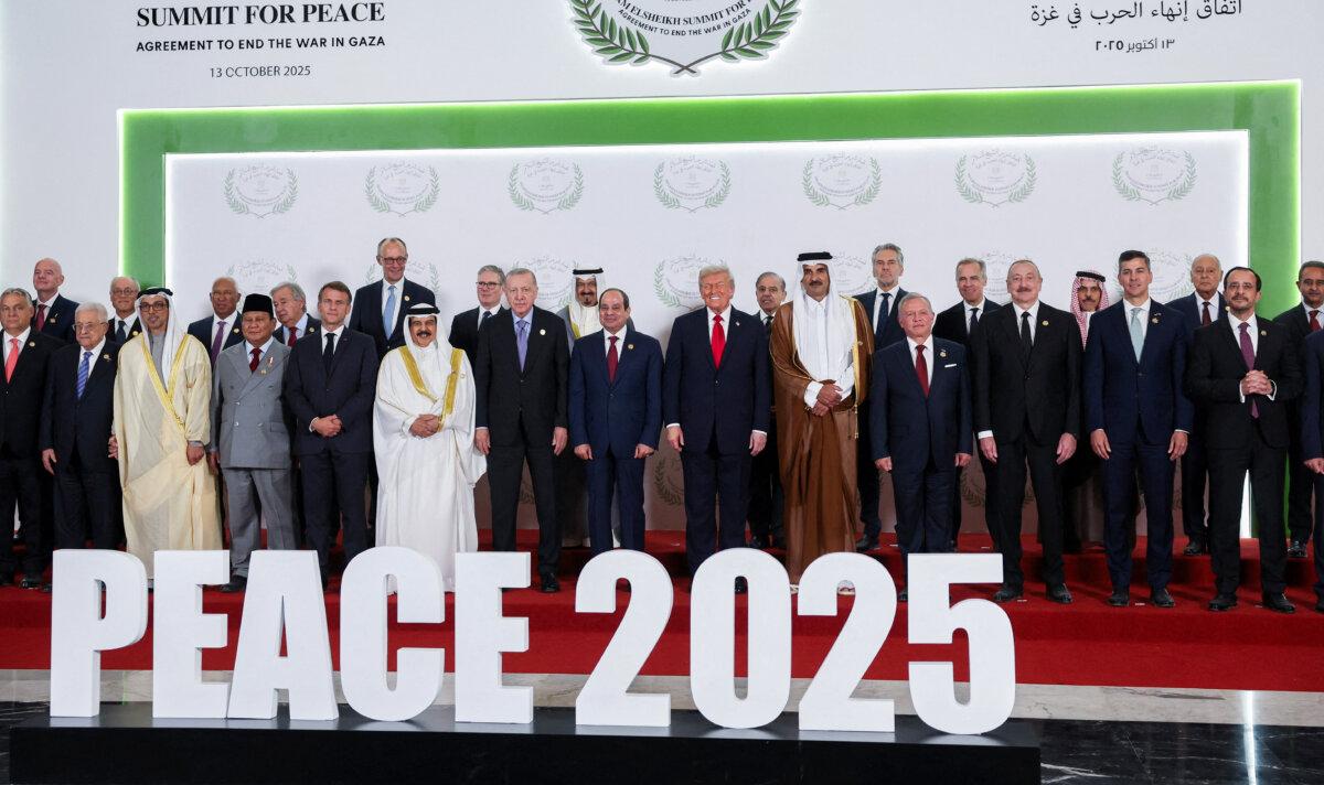 World leaders, including U.S. President Donald Trump, pose for a family photo, at a world leaders' summit on ending the war in the Gaza Strip in Sharm el-Sheikh, Egypt, on Oct. 13, 2025. (Suzanne Plunkett - Pool/Getty Images)