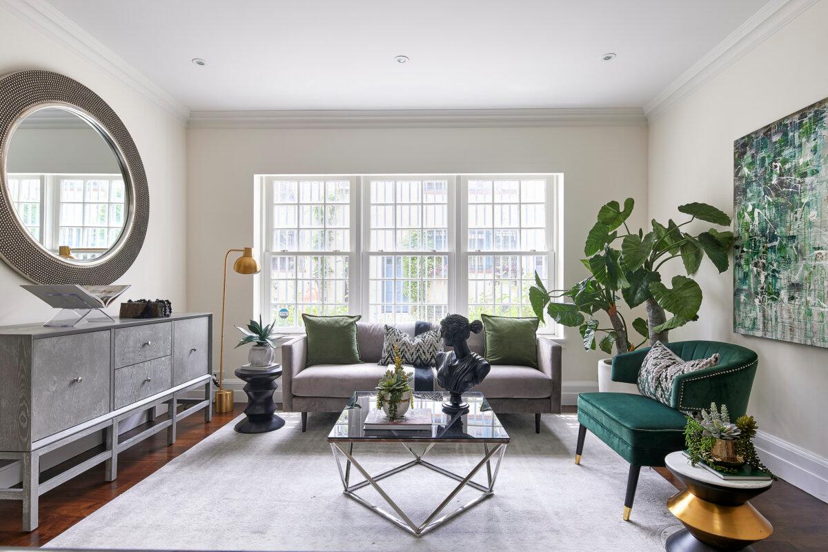 A living room layered with shades of green, natural textures, and touches of gold for a rich, inviting feel. (Handout/TNS)