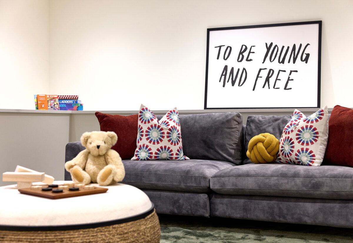 A playful family space where warm rust tones and patterned pillows add comfort and personality. (Handout/TNS)