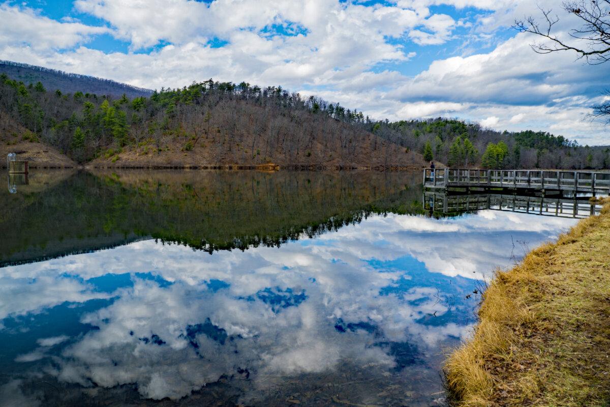 A fisherman on a pier, fishing for trout at Douthat Lake located at Douthat State Park in Millboro, Virginia, on Feb. 21, 2018. (Larry Metayer/Dreamstime/TNS)