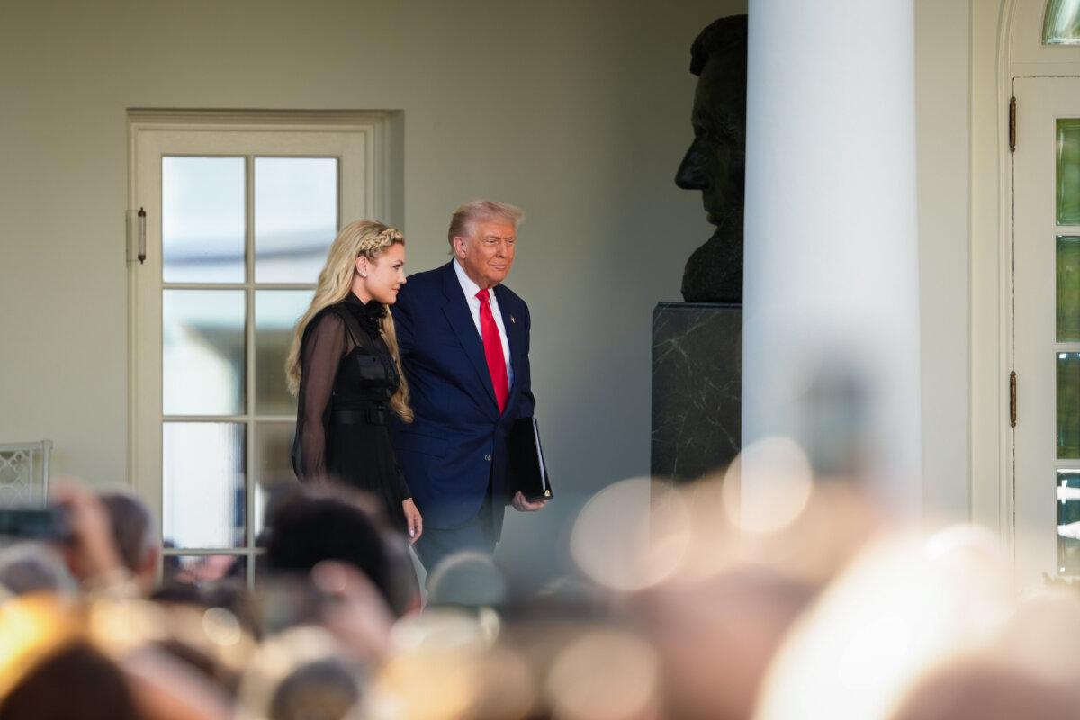 President Donald Trump and Erika Kirk, Charlie Kirk's widow, during a Medal of Freedom ceremony for Charlie Kirk at the Rose Garden at the White House on Oct. 14, 2025. (Madalina Kilroy/The Epoch Times)