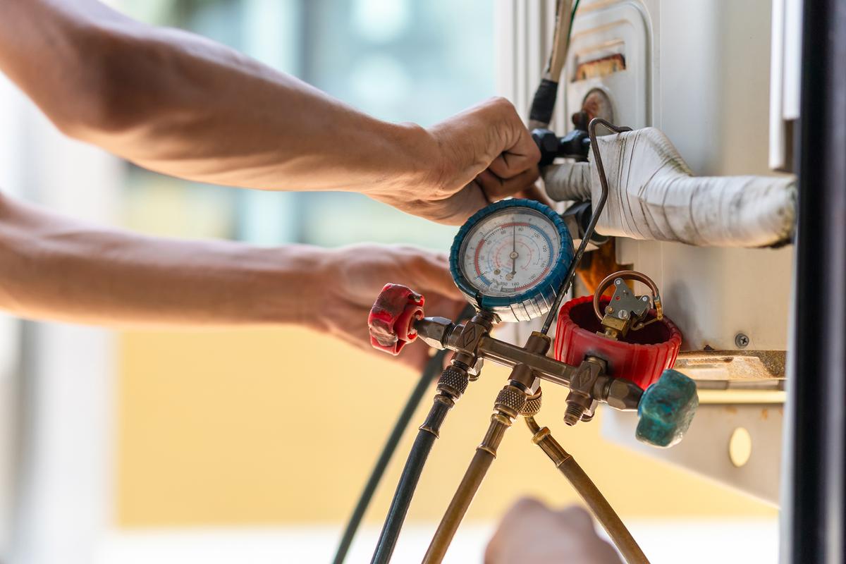 Regular professional inspections help detect issues early, from refrigerant leaks to faulty sensors. (Poguz.P/Shutterstock)