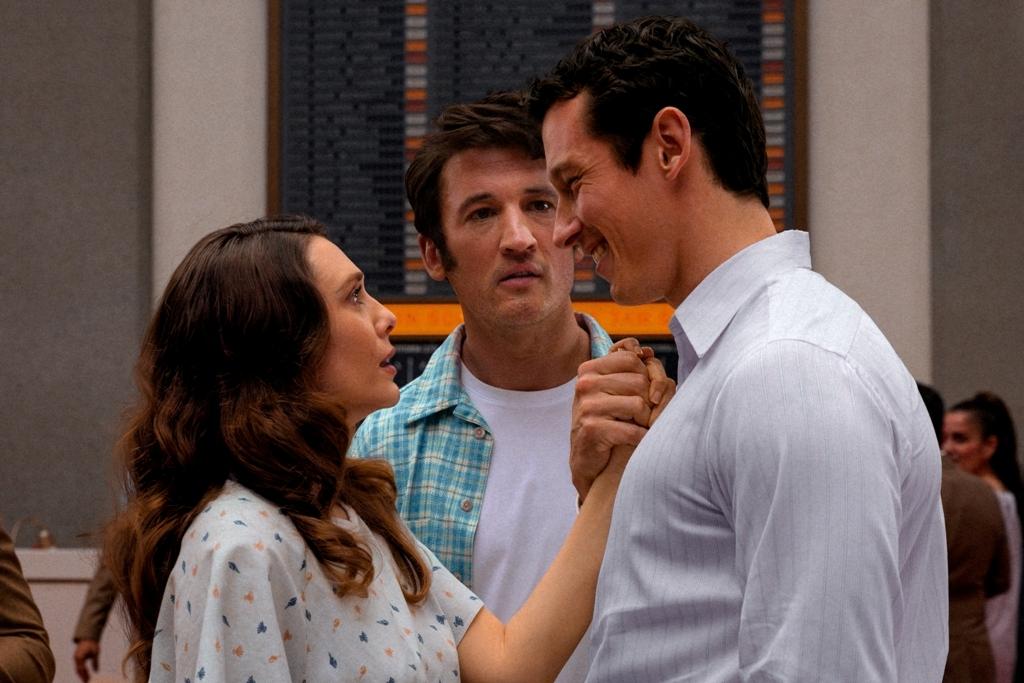 (L–R) Elizabeth Olsen as Joan, Miles Teller as Larry, and Callum Turner as Luke in "Eternity." (A24)