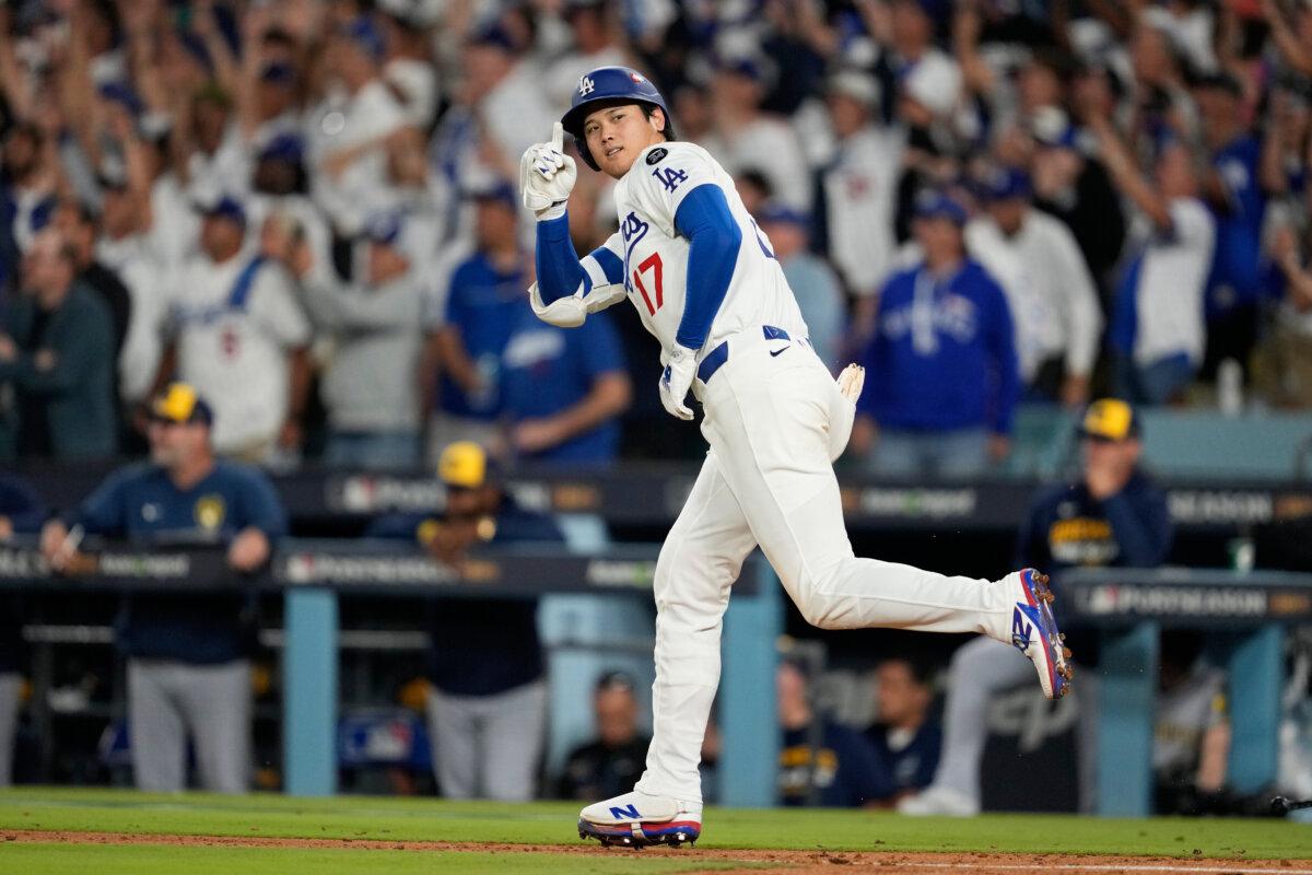 The Dodgers' Shohei Ohtani celebrates his home run against the Milwaukee Brewers in the seventh inning of Game 4 of baseball's National League Championship Series in Los Angeles on Oct. 17, 2025. (Ashley Landis/AP Photo)