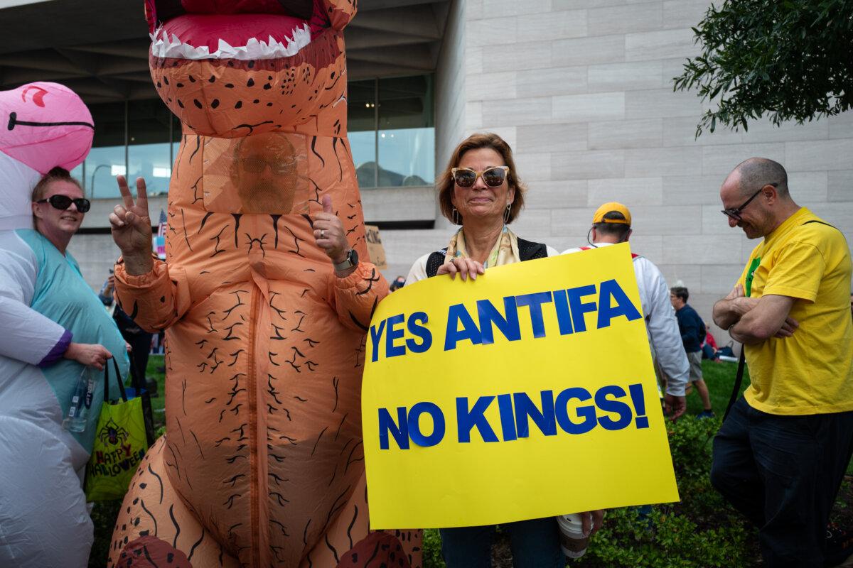 People participate in a "No Kings" protest in Washington, on Oct. 18, 2025. (Madalina Kilroy/The Epoch Times)