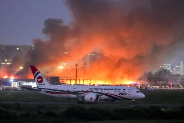 Day in Photos: Fire at Bangladesh Airport, Protest in Washington, and Mount Fuji