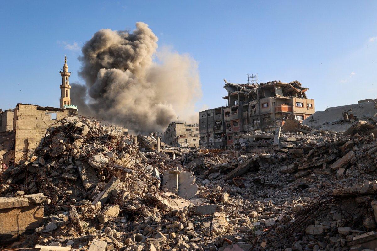 Smoke billows following an Israeli strike that targeted a building in the Bureij camp in the central Gaza Strip on Oct. 19, 2025. (Eyad BABA/AFP)