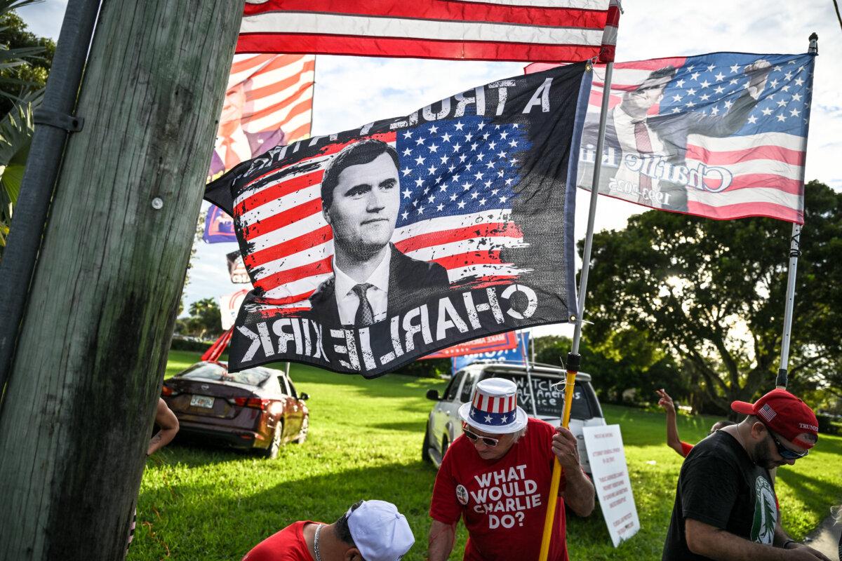 Supporters of Charlie Kirk rally outside the School District Welcome Center as a school board meeting takes place in West Palm Beach, Fla., on Oct. 15, 2025. (Chandan Khanna/AFP via Getty Images)