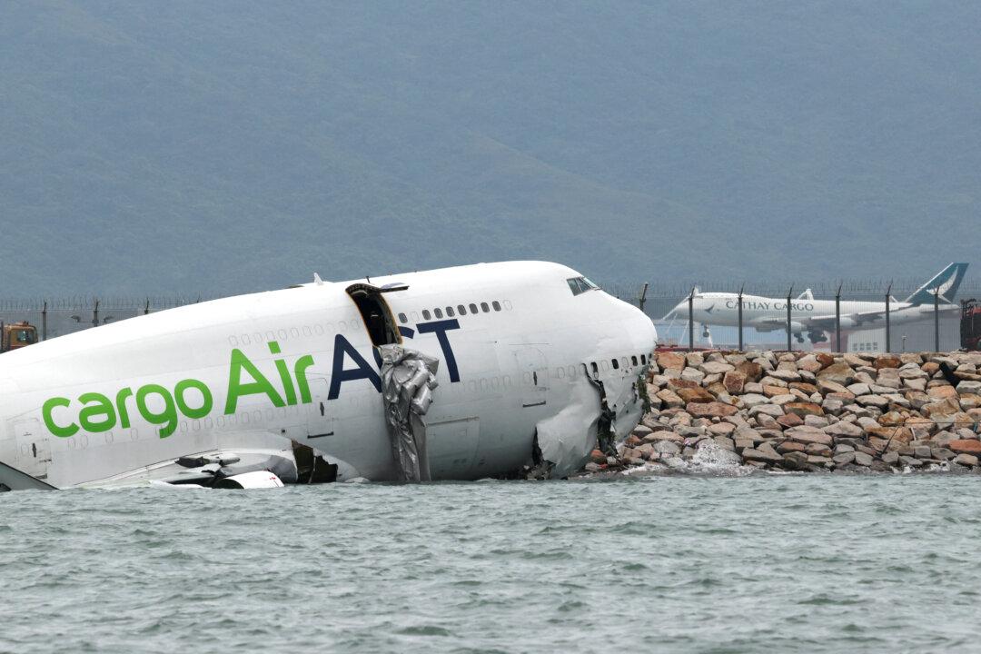 Cargo Aircraft Skids Off Hong Kong Runway Into Sea, Killing 2 Airport Workers