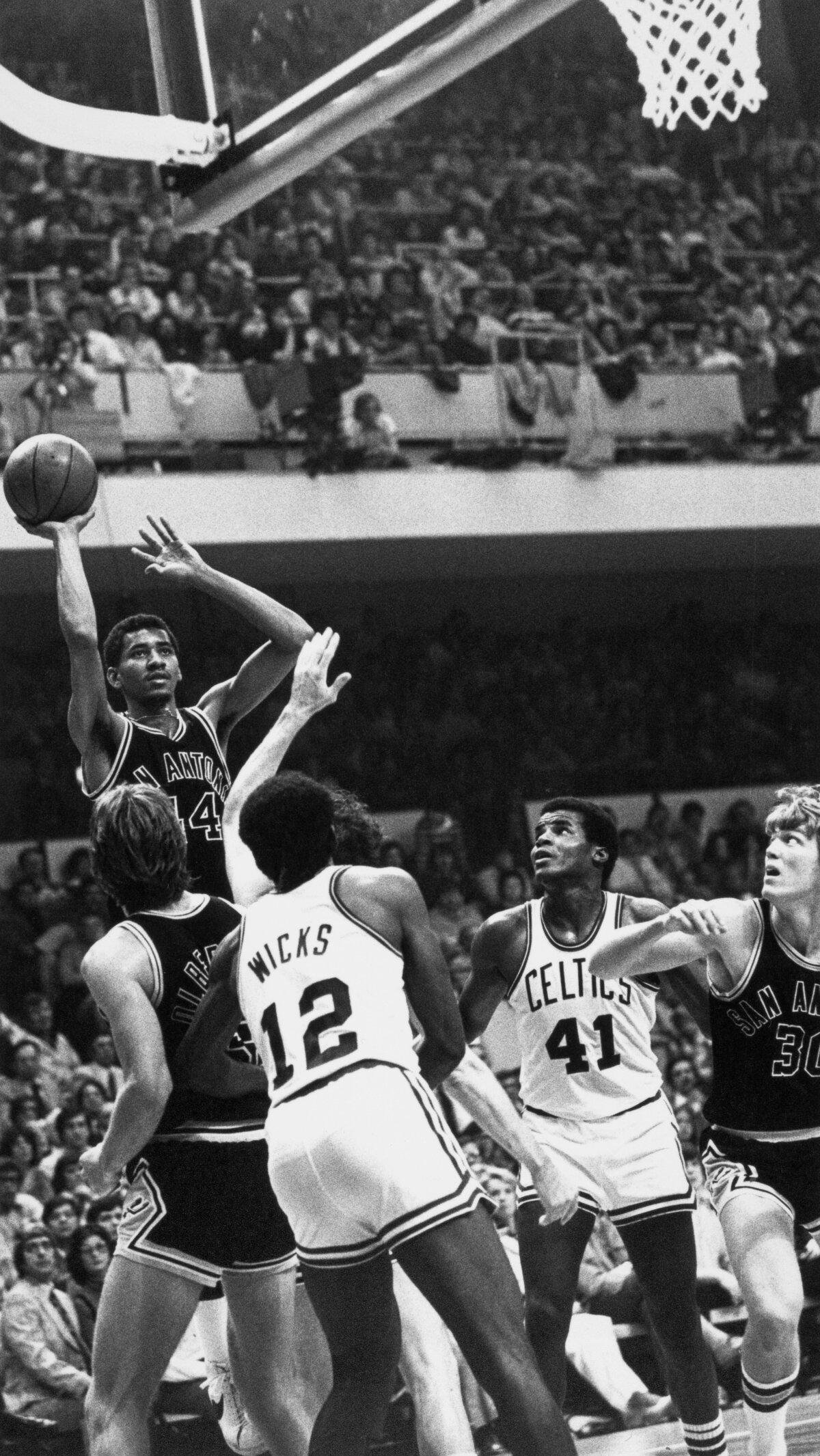 American basketball player George Gervin (44),of the San Antonio Spurs, leaps with the ball during NBA playoffs against the Boston Celtics at the Boston Garden stadium, Mass., 1977. (Sue Cassidy Clark/FPG/Archive Photos/Getty Images)