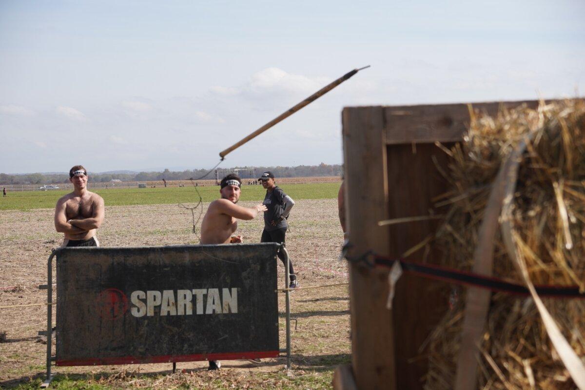 Runner throws javelins at the 2025 Tri-State New York Spartan Event Weekend in the Town of New Hampton, N.Y., on Oct. 19, 2025. (Oliver Mantyk/The Epoch Times)