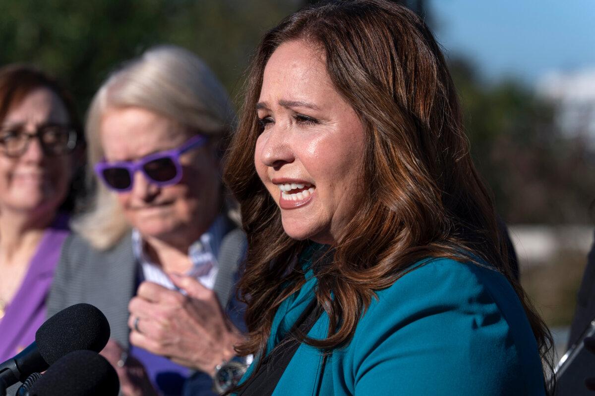 Rep.-elect Adelita Grijalva (D-Ariz.) speaks surrounded by supporters who have urged that House Speaker Mike Johnson swear her in at the Capitol in Washington on Oct. 15, 2025. (J. Scott Applewhite/AP Photo)