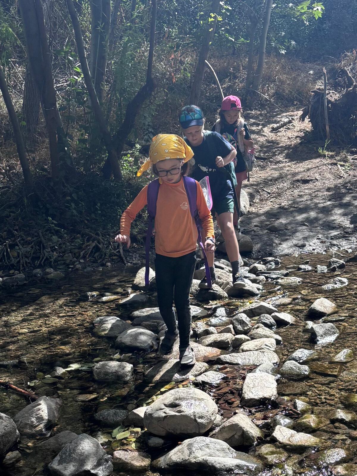 Children from HAWKs, a Los Angeles-based company that takes kids on outdoor adventures, cross the Arroyo Seco near Pasadena, Calif. (Jaclyn Cosgrove/Los Angeles Times/TNS)
