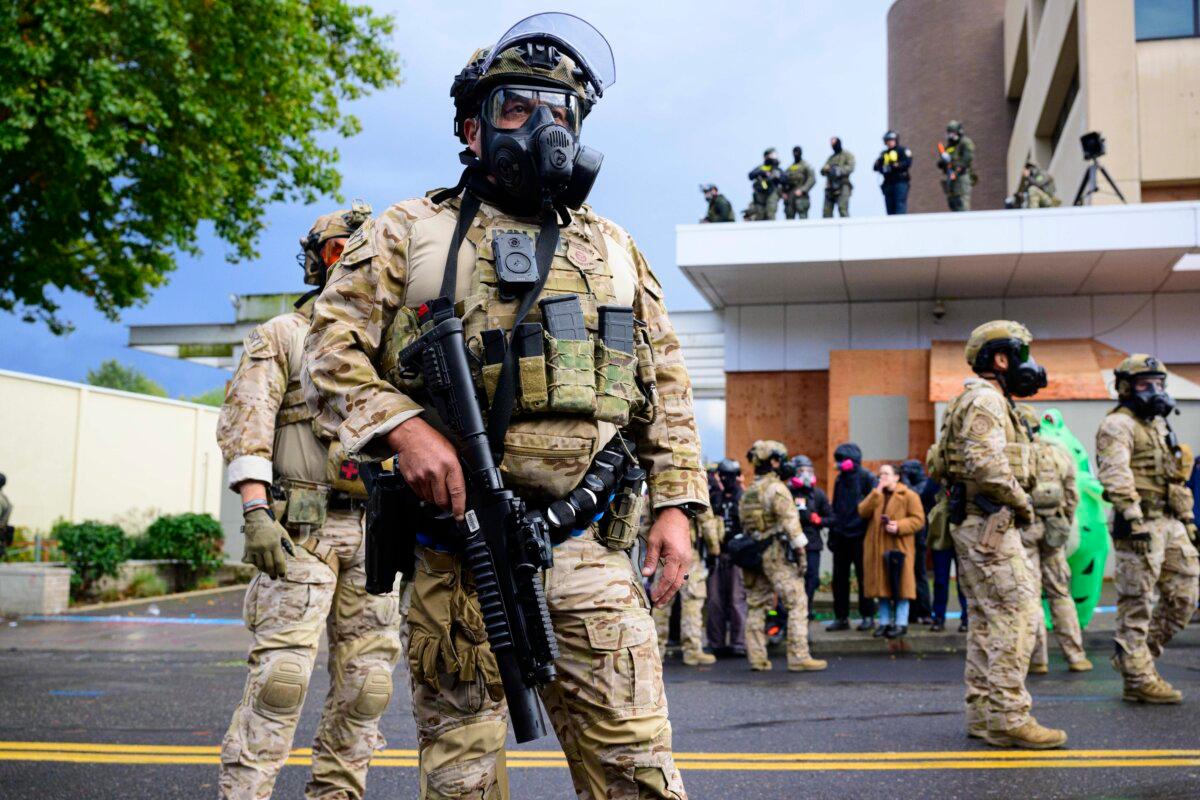Federal agents clash with protesters at the U.S. Immigration and Customs Enforcement building in Portland, Ore., on Oct. 12, 2025. (Mathieu Lewis-Rolland/Getty Images)