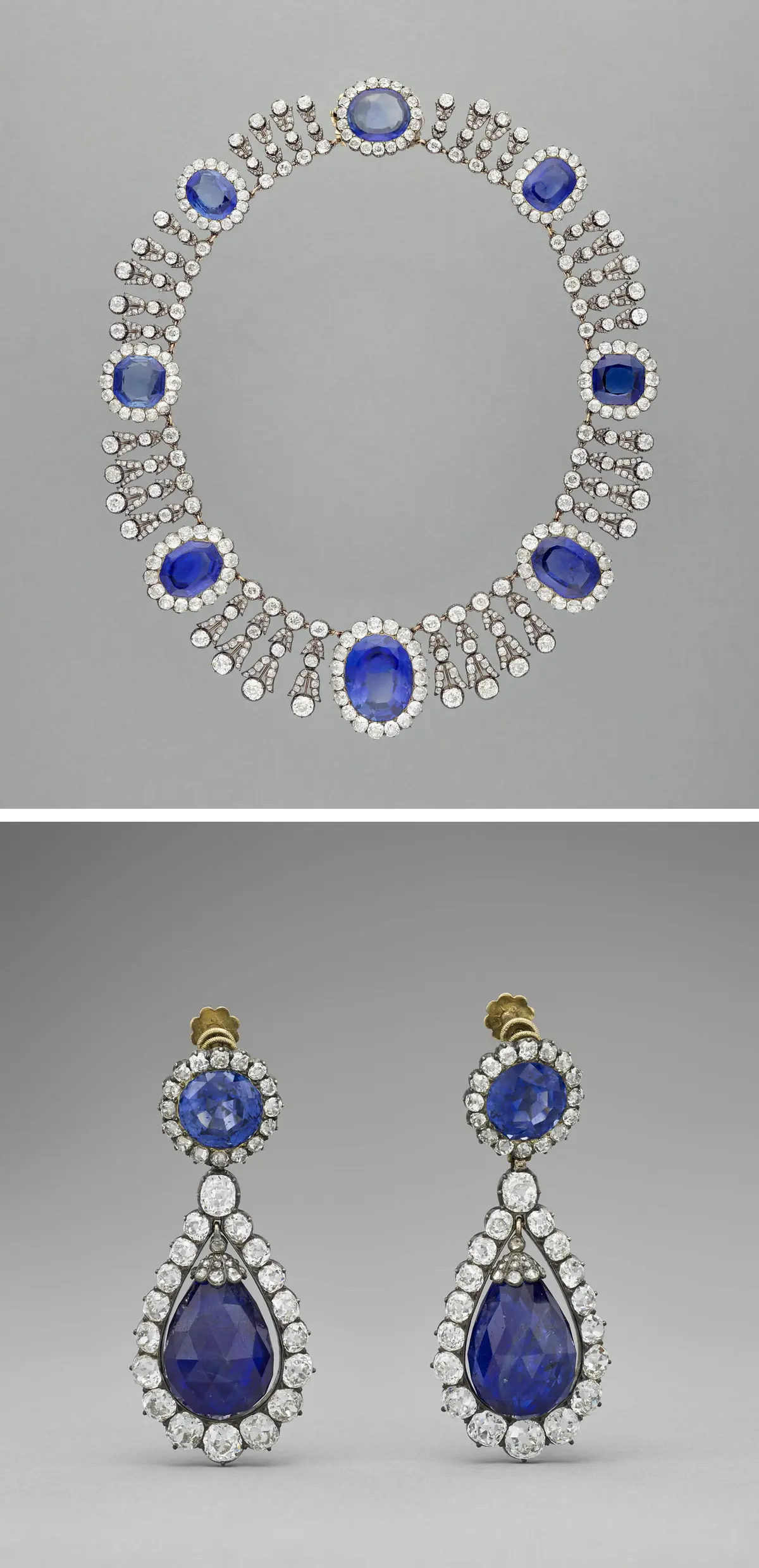 French Heritage Heist: The Sparkly Stories Behind the Louvre’s Stolen Jewels | USNN World News Necklace and earrings from the parure of Queen Marie-Amélie and Queen Hortense from the early 19th century. Diamond and Ceylon sapphire; necklace measuring 1 3/10 inches by 15 3/4 inches and earrings measuring 2 inches by 9/10 inch. (Stéphane Maréchalle/ Musée du Louvre)