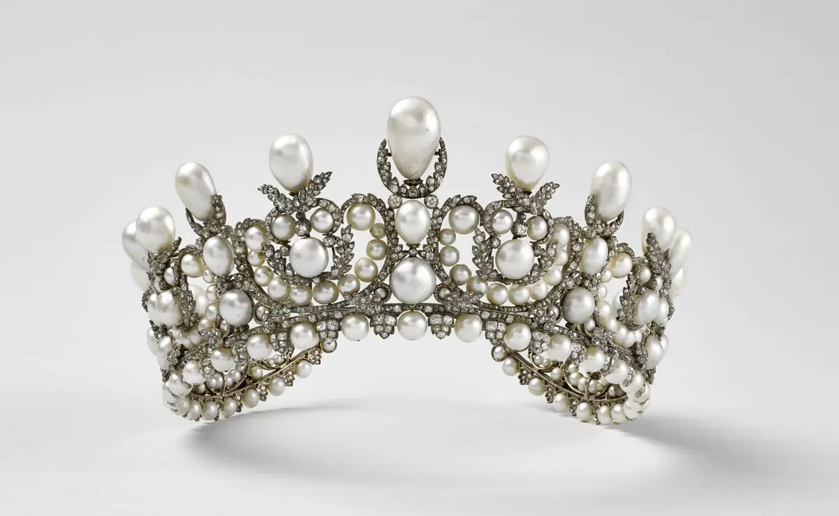 French Heritage Heist: The Sparkly Stories Behind the Louvre’s Stolen Jewels | USNN World News Tiara of Empress Eugénie, 1853, by Alexandre-Gabriel Lemonnier. Pearl and diamond; 2 3/4 inches by 7 1/2 inches by 7 3/10 inches. (Stéphane Maréchalle/ Musée du Louvre)