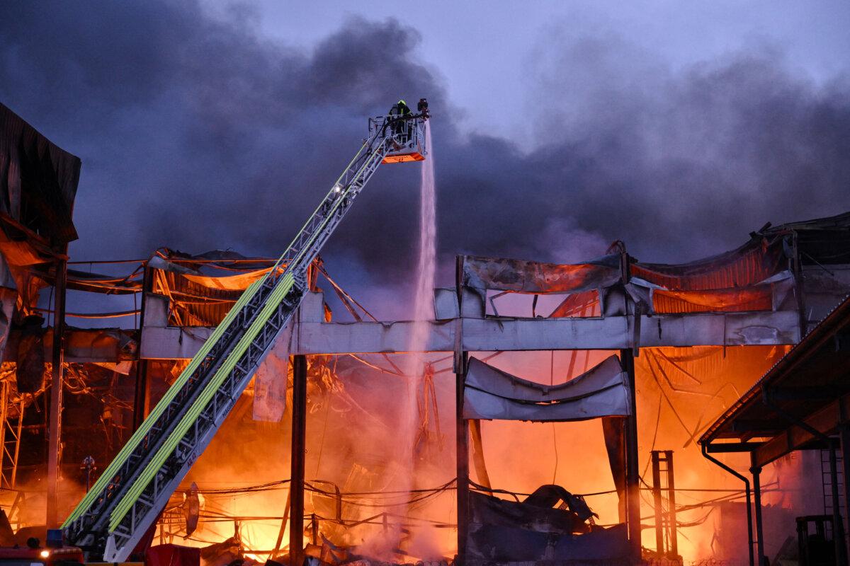 Ukrainian firefighters extinguish a fire at the site of a food warehouse after a Russian missile strike in Kyiv on Oct. 25, 2025, amid the Russian conflict with Ukraine. (Genya Savilov/AFP via Getty Images)