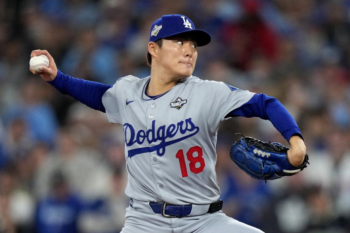 Los Angeles Dodgers pitcher Yoshinobu Yamamoto delivers during the sixth inning in Game 2 of MLB's World Series against the Toronto Blue Jays, in Toronto on Oct. 25, 2025. (Nathan Denette/The Canadian Press via AP)