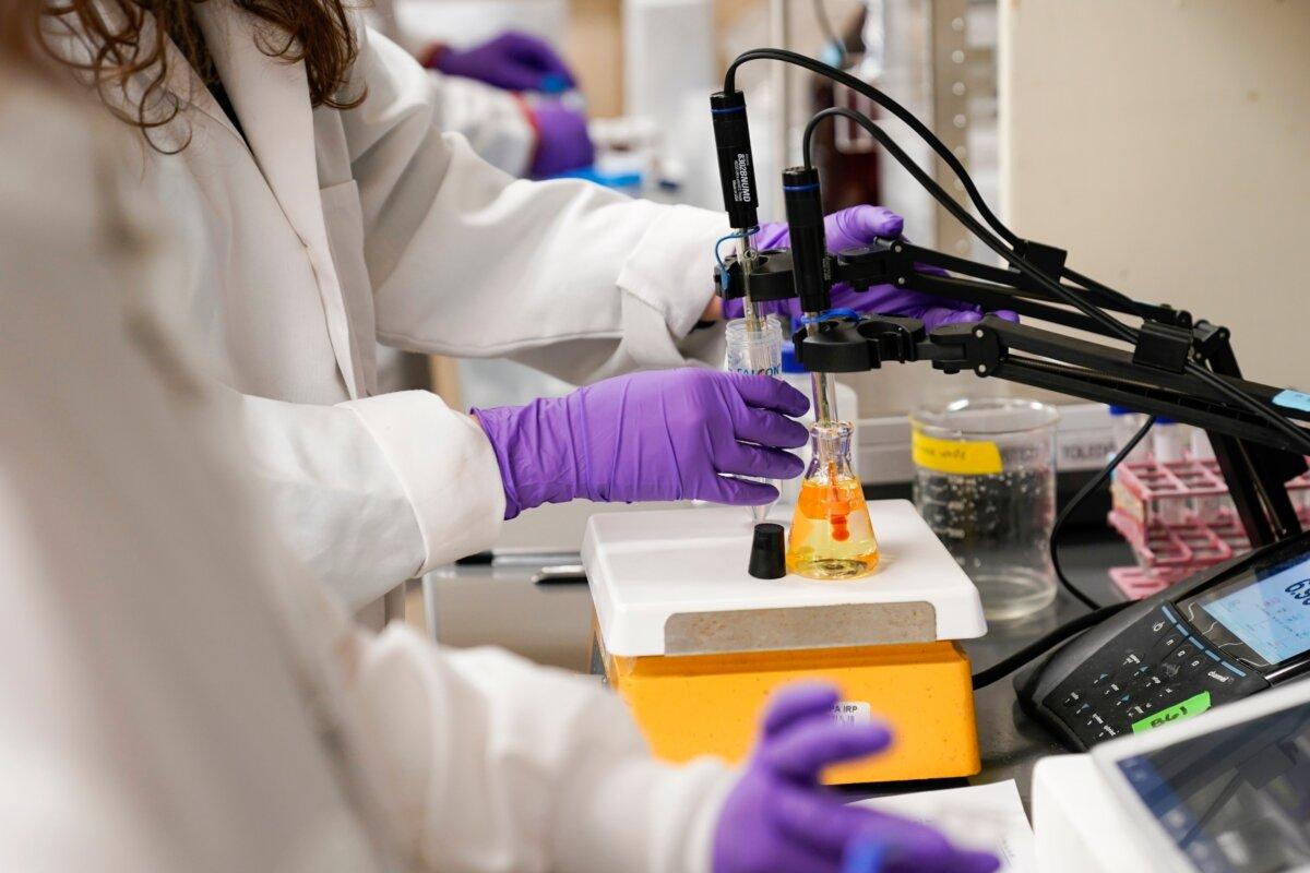 A water researcher tests a sample of water for PFAS at the U.S. Environmental Protection Agency Center for Environmental Solutions and Emergency Response in Cincinnati, Ohio, on Feb. 14, 2023. (Joshua A. Bickel/AP Photo)