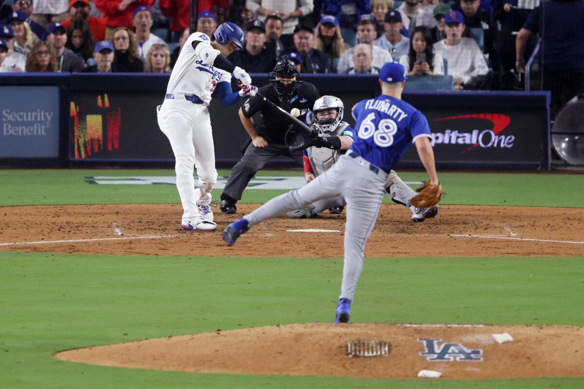 Shohei Ohtani of the Los Angeles Dodgers hits an RBI double against the Toronto Blue Jays during the fifth inning in Game 3 of the 2025 World Series at Dodger Stadium in Los Angeles on Oct. 27, 2025. (Luke Hales/Getty Images)