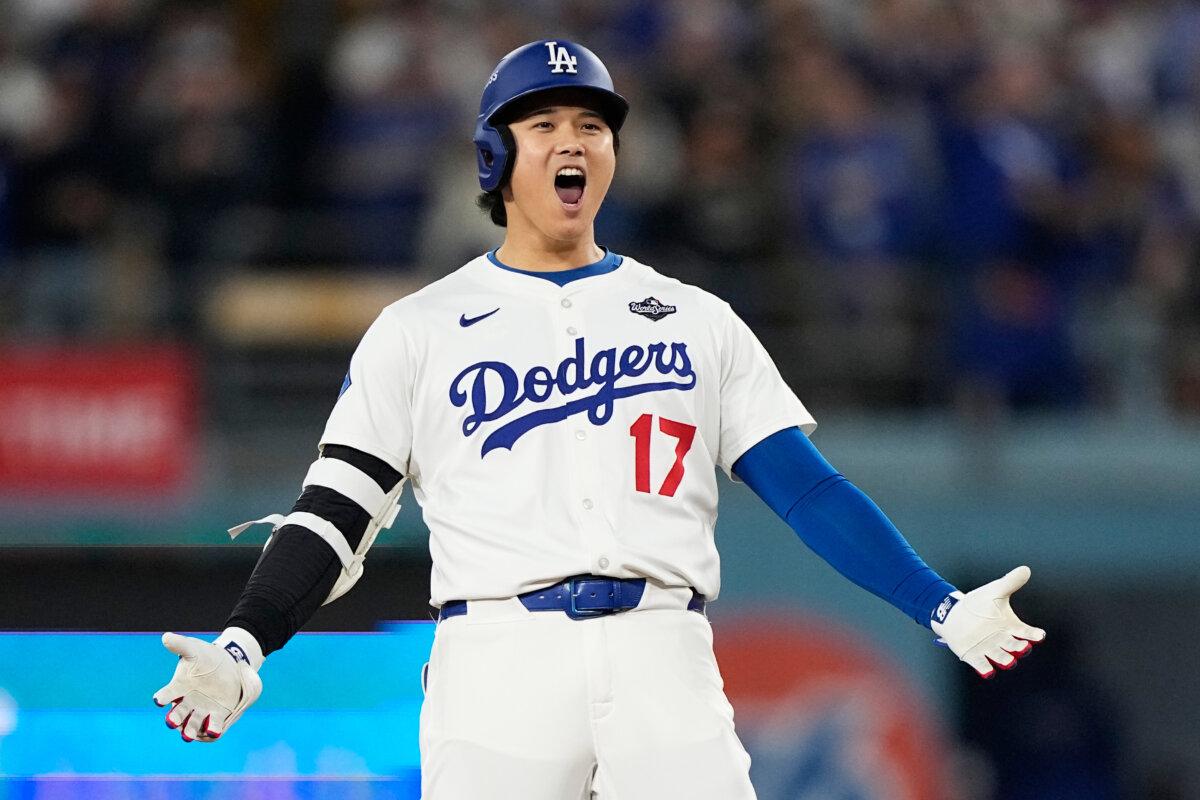 Los Angeles Dodgers' Shohei Ohtani celebrates his RBI-Double against the Toronto Blue Jays during the fifth inning in Game 3 of MLB's World Series in Los Angeles on Oct. 27, 2025. (AP Photo/Brynn Anderson)