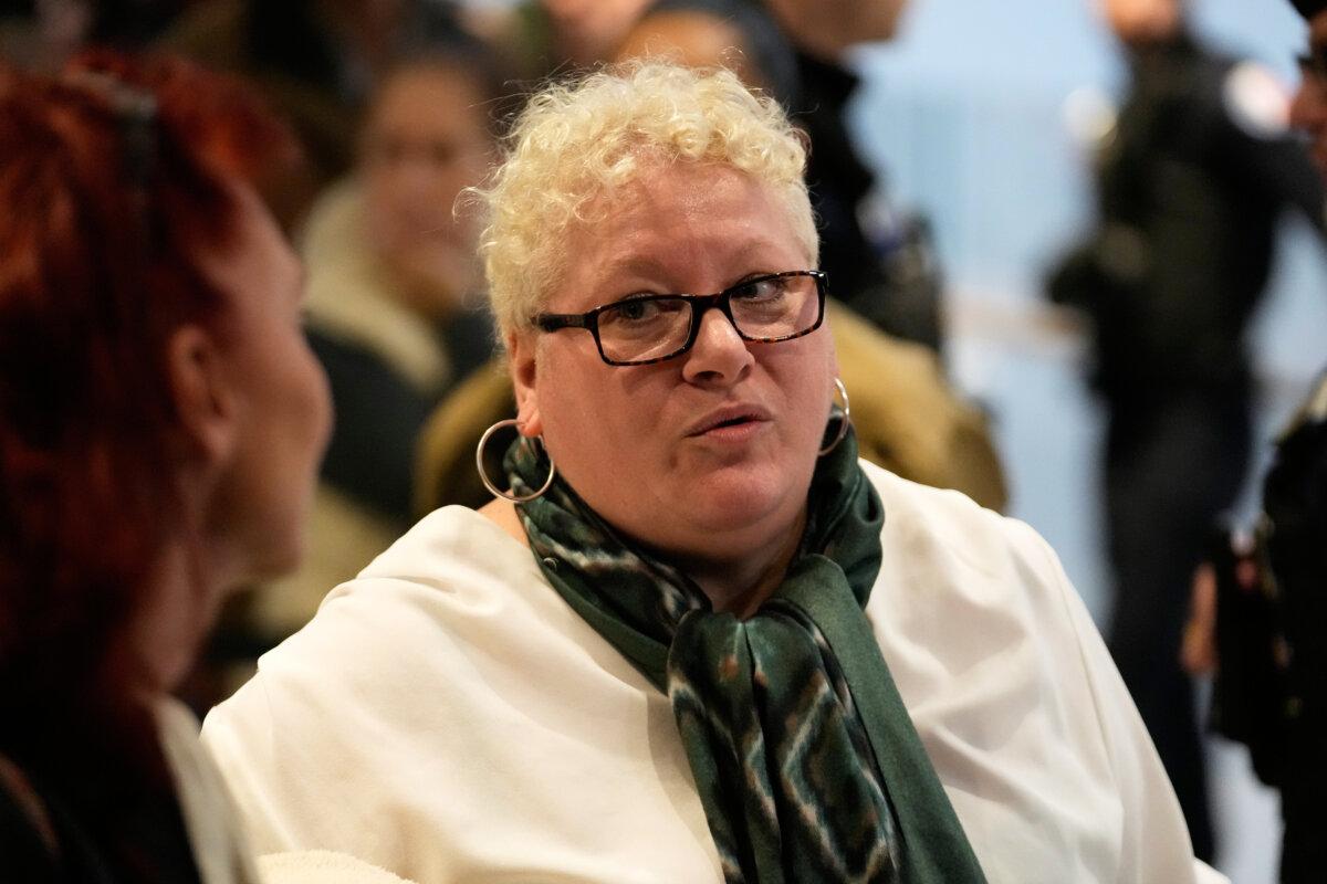 Defendant Delphine Jegousse, known as Amandine Roy, arrives at the courtroom in Paris on Oct. 27, 2025. (AP Photo/Michel Euler)